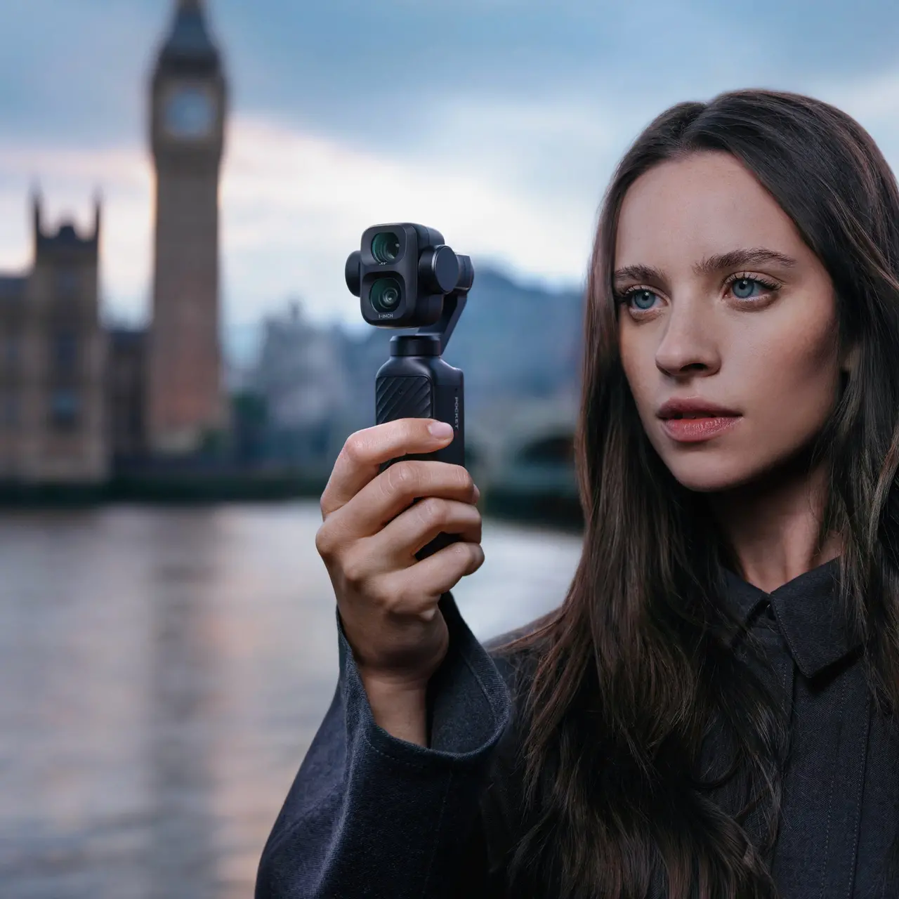Creator holding a DJI Osmo Pocket 4P while filming in London