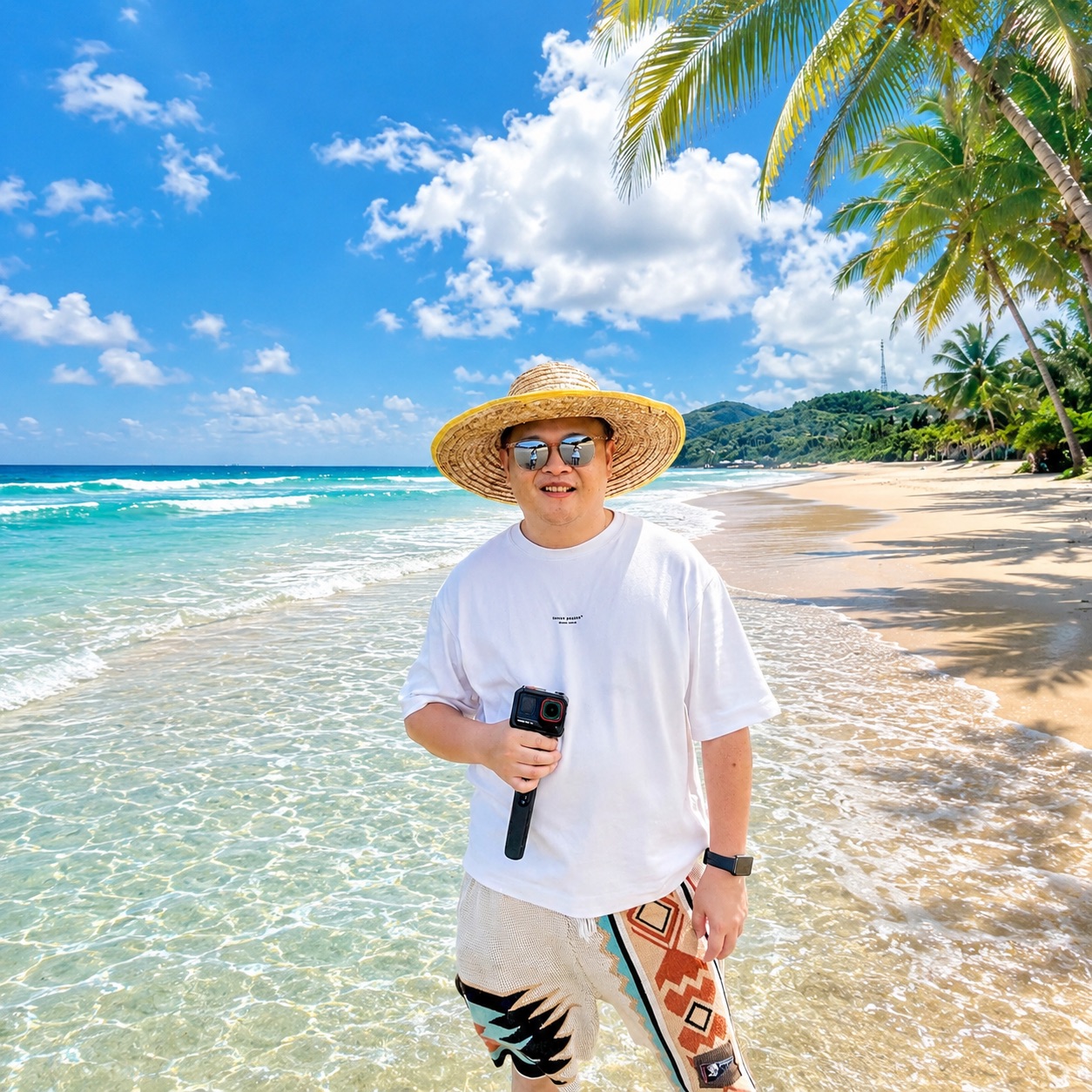 Alex enjoying a sunny tropical beach with turquoise water