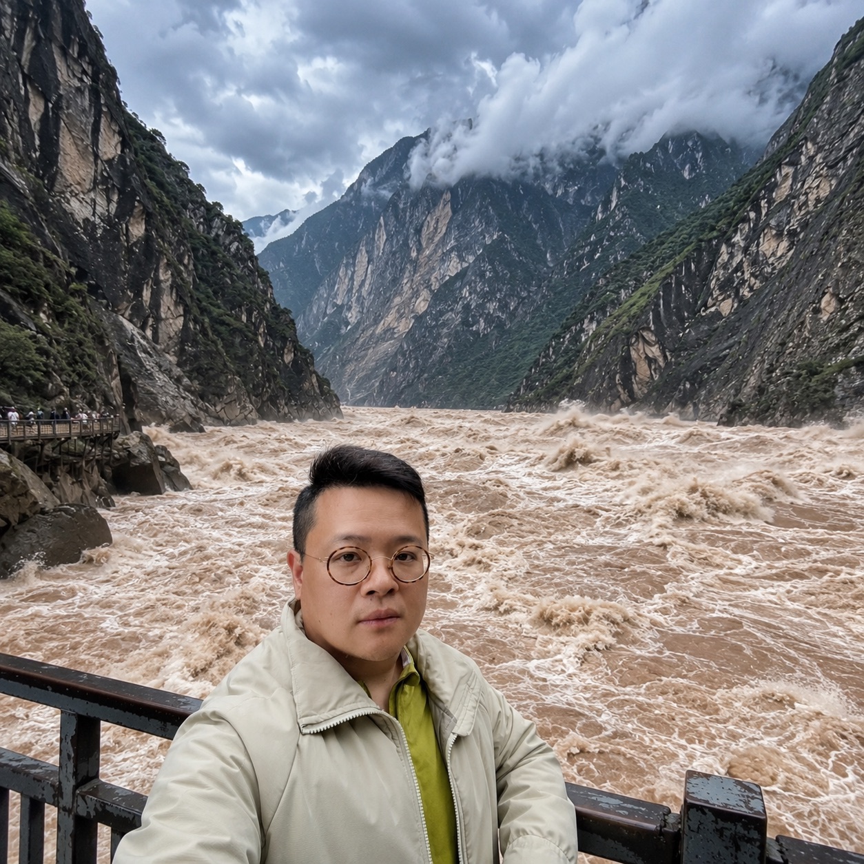 Alex beside the rushing water of Tiger Leaping Gorge